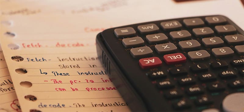 Virginia Renters Insurance - Calculator Resting on Lined Paper Notes